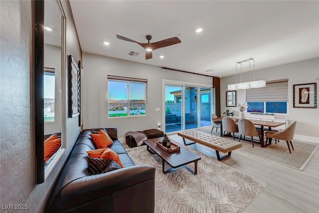 93 Reverie Heights Ave, Henderson, NV 89011 - living area with visible vents, baseboards, light wood-type flooring, a ceiling fan, and recessed lighting