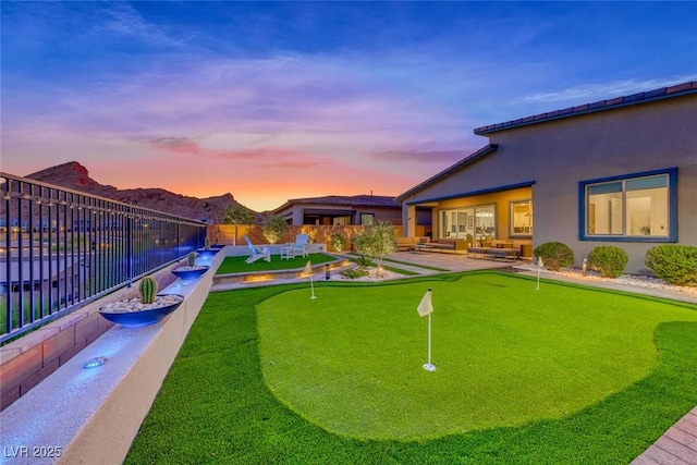 93 Reverie Heights Ave, Henderson, NV 89011 - view of yard with a patio area, a fenced backyard, an outdoor living space, and a mountain view