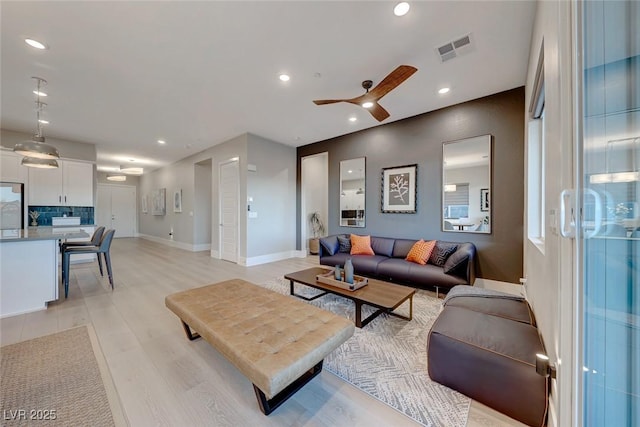 93 Reverie Heights Ave, Henderson, NV 89011 - living room featuring light wood-style floors, ceiling fan, visible vents, recessed lighting, and baseboards