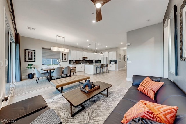 93 Reverie Heights Ave, Henderson, NV 89011 - living room featuring baseboards, recessed lighting, a ceiling fan, visible vents, and light wood finished floors