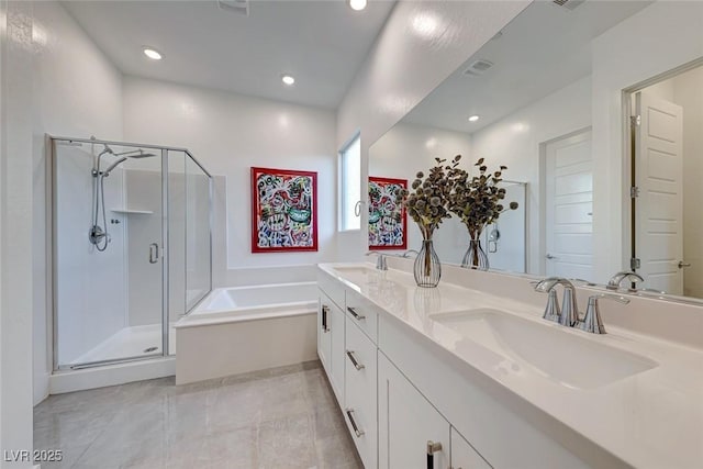 93 Reverie Heights Ave, Henderson, NV 89011 - full bath featuring a shower stall, a bath, a sink, and recessed lighting
