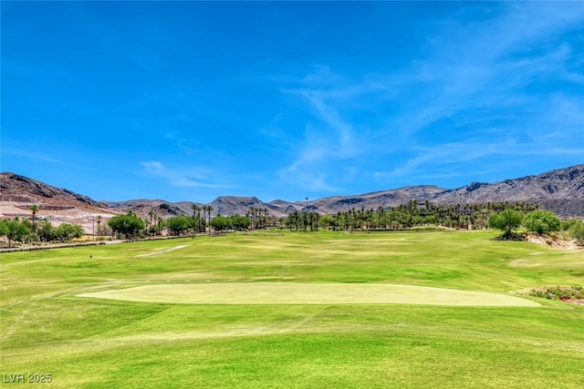 93 Reverie Heights Ave, Henderson, NV 89011 - view of home's community with golf course view, a yard, and a mountain view