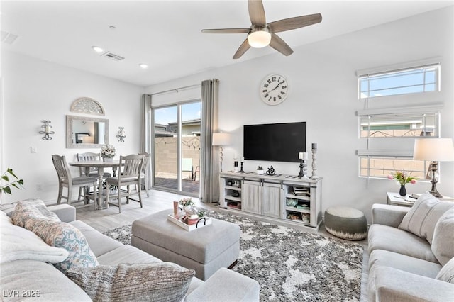 916 Belleforte Ln, Las Vegas, NV 89138 - living room with a ceiling fan, plenty of natural light, and wood finished floors