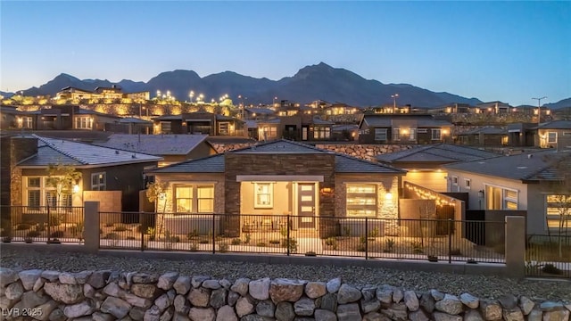916 Belleforte Ln, Las Vegas, NV 89138 - back of house featuring a mountain view and stone siding