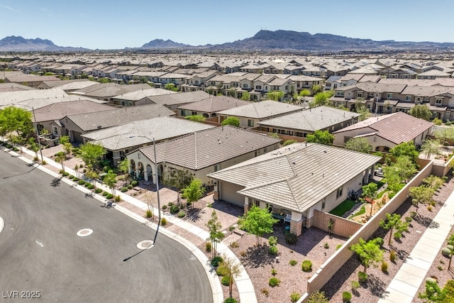 birds eye view of property with a mountain view and a residential view