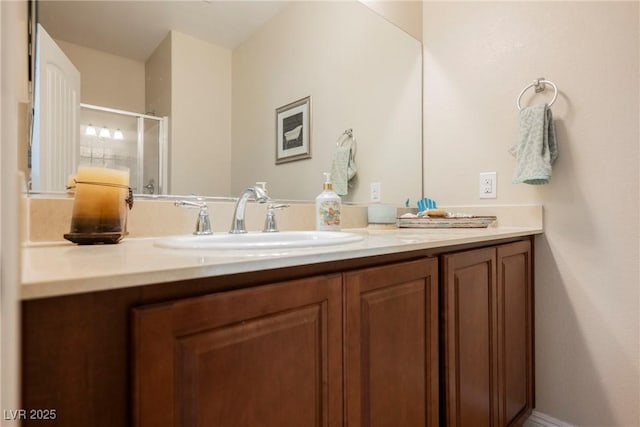 bathroom featuring vanity and a shower stall
