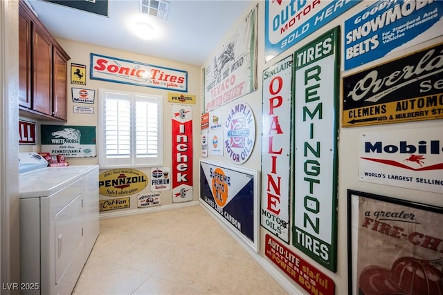 interior space with washer and dryer, cabinet space, and visible vents