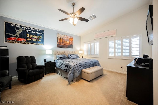 carpeted bedroom with vaulted ceiling, a ceiling fan, baseboards, ornamental molding, and visible vents