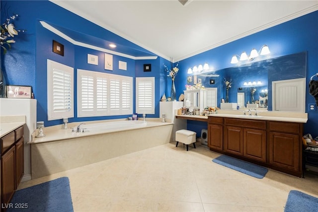 full bath with a garden tub, tile patterned floors, vanity, lofted ceiling, and ornamental molding