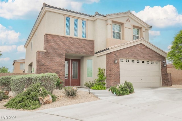 view of front of property with driveway, a tiled roof, and stucco siding