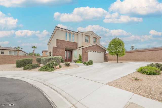 traditional home with fence, a tiled roof, driveway, and stucco siding