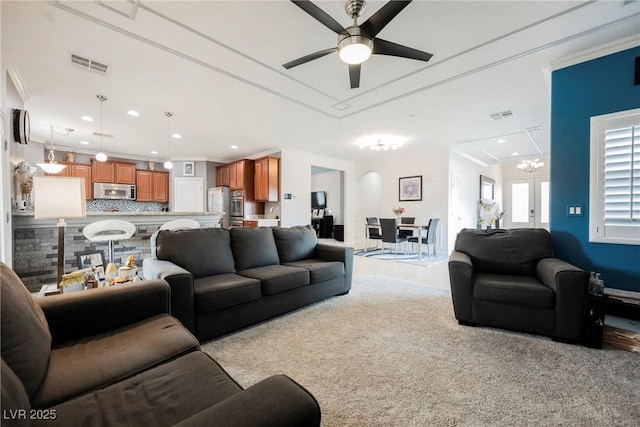 living area featuring a ceiling fan, visible vents, and recessed lighting