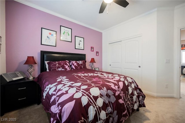 bedroom with baseboards, a closet, ceiling fan, crown molding, and carpet floors