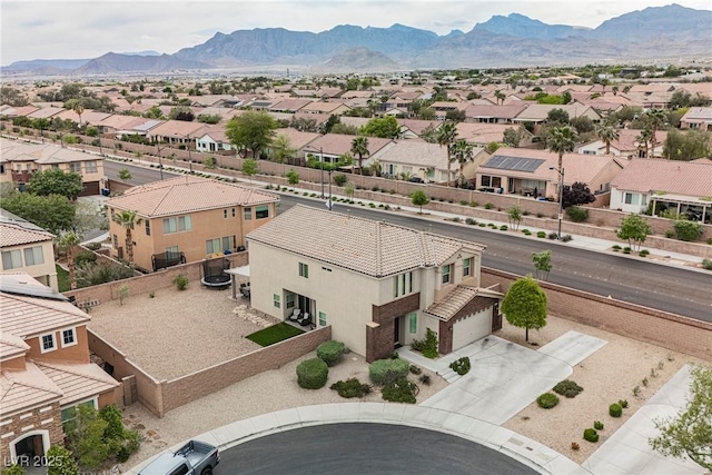 birds eye view of property with a mountain view and a residential view