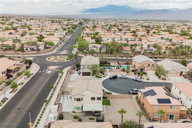 drone / aerial view featuring a residential view and a mountain view