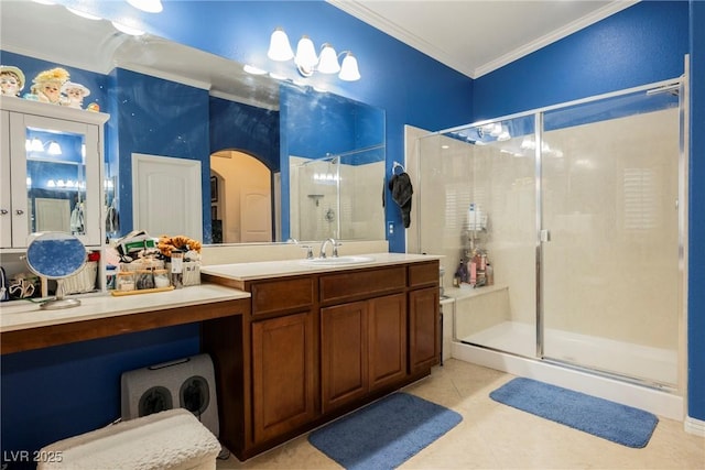 full bathroom with vanity, tile patterned flooring, ornamental molding, and a stall shower