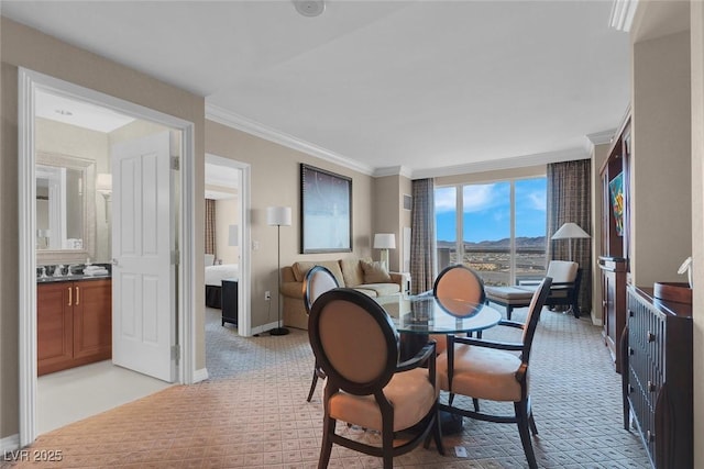 125 E Harmon Ave Unit 2220, Las Vegas, NV 89109 - dining space featuring crown molding, light colored carpet, and baseboards