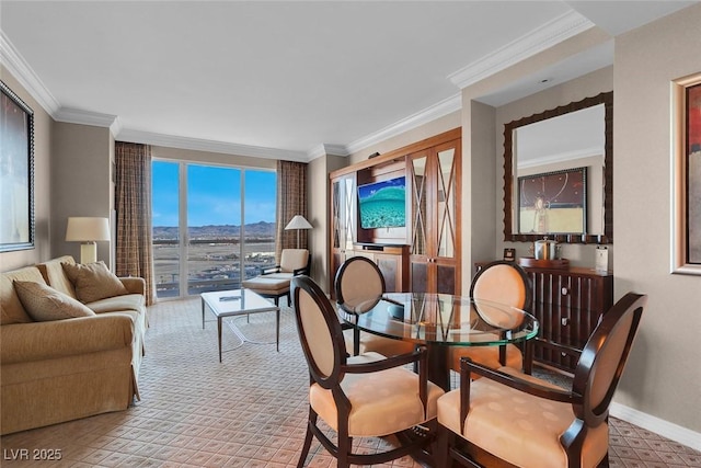125 E Harmon Ave Unit 2220, Las Vegas, NV 89109 - dining area with baseboards, ornamental molding, and light carpet