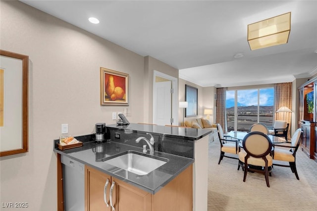 125 E Harmon Ave Unit 2220, Las Vegas, NV 89109 - kitchen with crown molding, a sink, white dishwasher, open floor plan, and light carpet