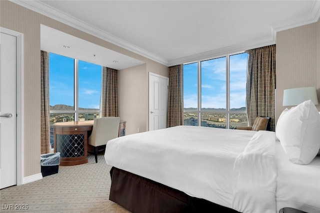 125 E Harmon Ave Unit 2220, Las Vegas, NV 89109 - bedroom with crown molding, a mountain view, carpet flooring, and baseboards