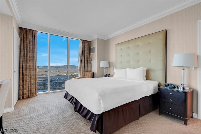 125 E Harmon Ave Unit 2220, Las Vegas, NV 89109 - bedroom featuring light carpet, a wall of windows, a mountain view, and crown molding
