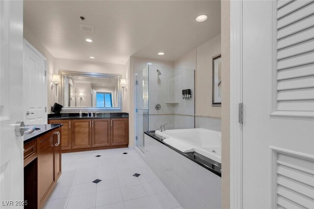 125 E Harmon Ave Unit 2220, Las Vegas, NV 89109 - full bath with a stall shower, recessed lighting, a bath, vanity, and tile patterned flooring