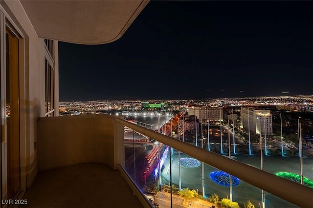 125 E Harmon Ave Unit 2220, Las Vegas, NV 89109 - balcony at twilight with a view of city lights
