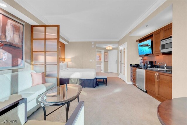 145 E Harmon Ave Unit 2411, Las Vegas, NV 89109 - living room featuring ornamental molding and light colored carpet