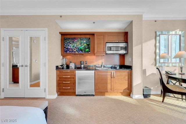 145 E Harmon Ave Unit 2411, Las Vegas, NV 89109 - indoor wet bar with stainless steel microwave, french doors, ornamental molding, baseboards, and refrigerator