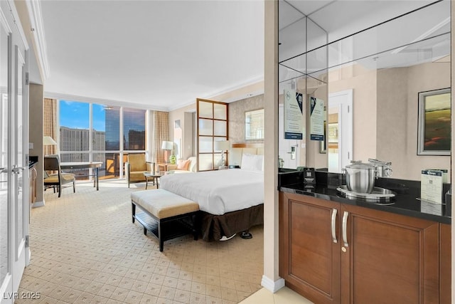 145 E Harmon Ave Unit 2411, Las Vegas, NV 89109 - bedroom with light colored carpet, ornamental molding, and expansive windows