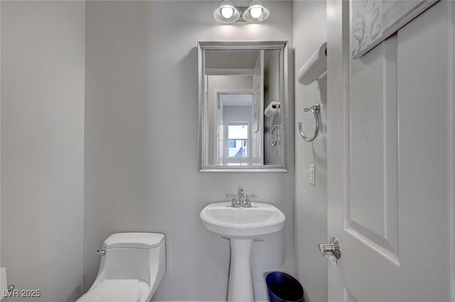 half bath featuring toilet