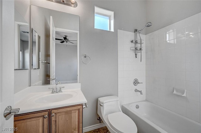 bathroom with vanity, a ceiling fan, shower / bathtub combination, and toilet