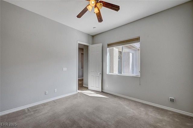 unfurnished bedroom featuring carpet floors, baseboards, and ceiling fan