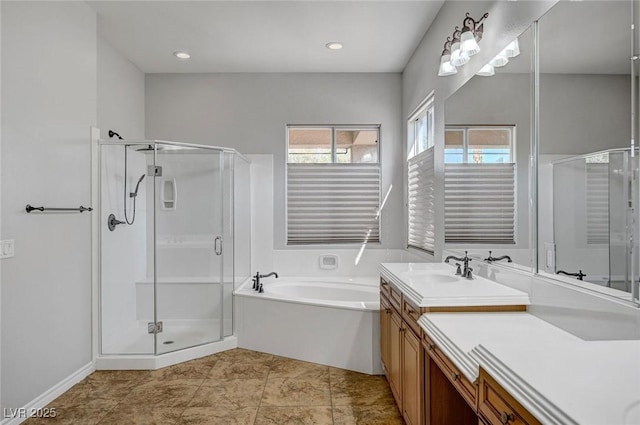 bathroom with vanity, a shower stall, and a bath