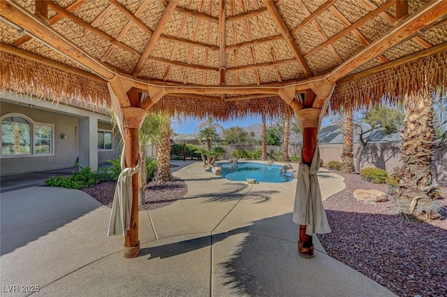 view of swimming pool with a gazebo, a fenced backyard, a fenced in pool, and a patio