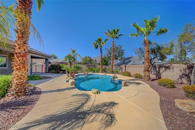 view of pool featuring a fenced backyard, a fenced in pool, and a patio