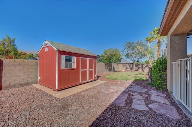 view of shed with a fenced backyard