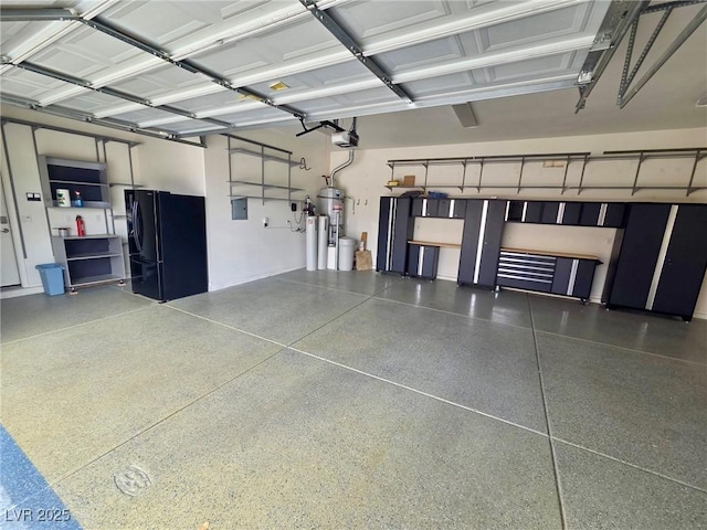 garage with freestanding refrigerator and a garage door opener