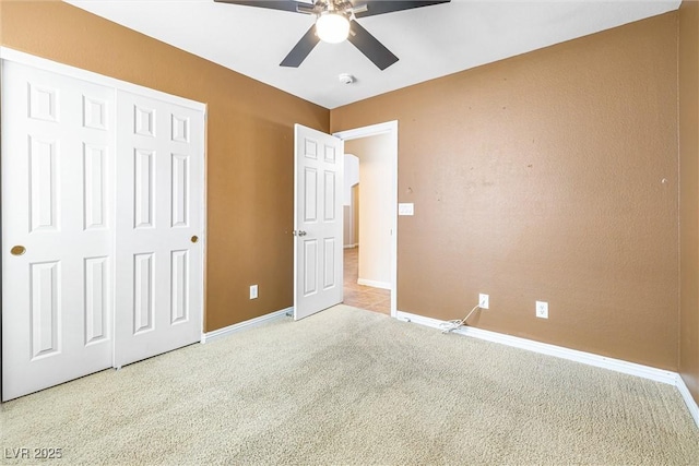 9539 Iris Flat Ct, Las Vegas, NV 89178 - unfurnished bedroom with carpet, baseboards, a closet, and a ceiling fan