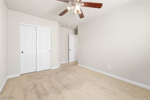9539 Iris Flat Ct, Las Vegas, NV 89178 - unfurnished bedroom with light carpet, baseboards, a closet, and a ceiling fan