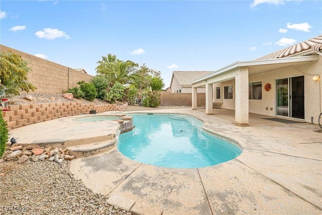 9539 Iris Flat Ct, Las Vegas, NV 89178 - view of swimming pool featuring a patio area, a fenced backyard, and a pool with connected hot tub
