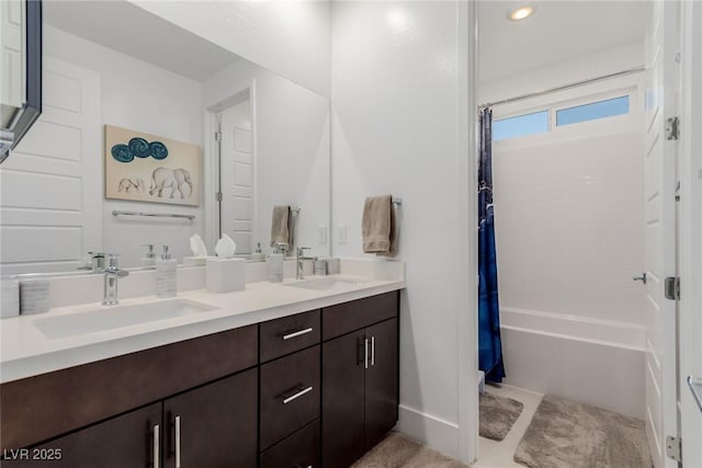 bathroom with double vanity, shower / tub combo with curtain, and recessed lighting