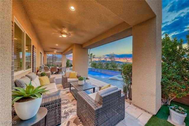 view of patio with outdoor dining space, an outdoor living space, an outdoor pool, and ceiling fan