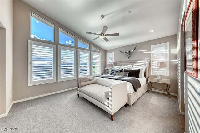 carpeted bedroom featuring ceiling fan, baseboards, and vaulted ceiling