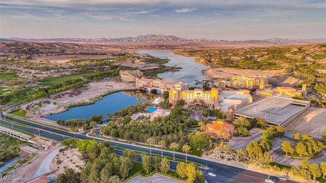 drone / aerial view with a water and mountain view