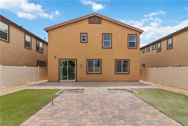 5317 Golden Melody Ln, North Las Vegas, NV 89081 - back of property featuring stucco siding and a patio area