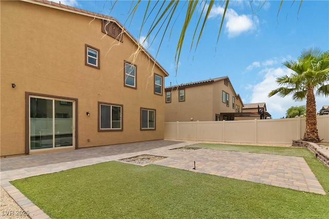 5317 Golden Melody Ln, North Las Vegas, NV 89081 - back of property with stucco siding and a patio area