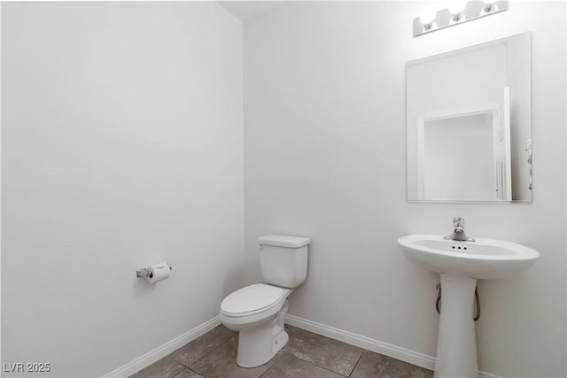 5317 Golden Melody Ln, North Las Vegas, NV 89081 - half bath with toilet, baseboards, and tile patterned floors