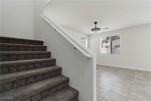 5317 Golden Melody Ln, North Las Vegas, NV 89081 - staircase with tile patterned floors and baseboards