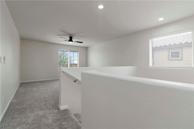 5317 Golden Melody Ln, North Las Vegas, NV 89081 - hall featuring light carpet, baseboards, recessed lighting, and an upstairs landing